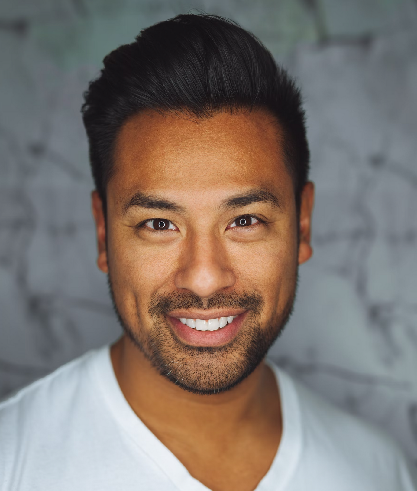 Portrait of an asian man wearing a white shirt