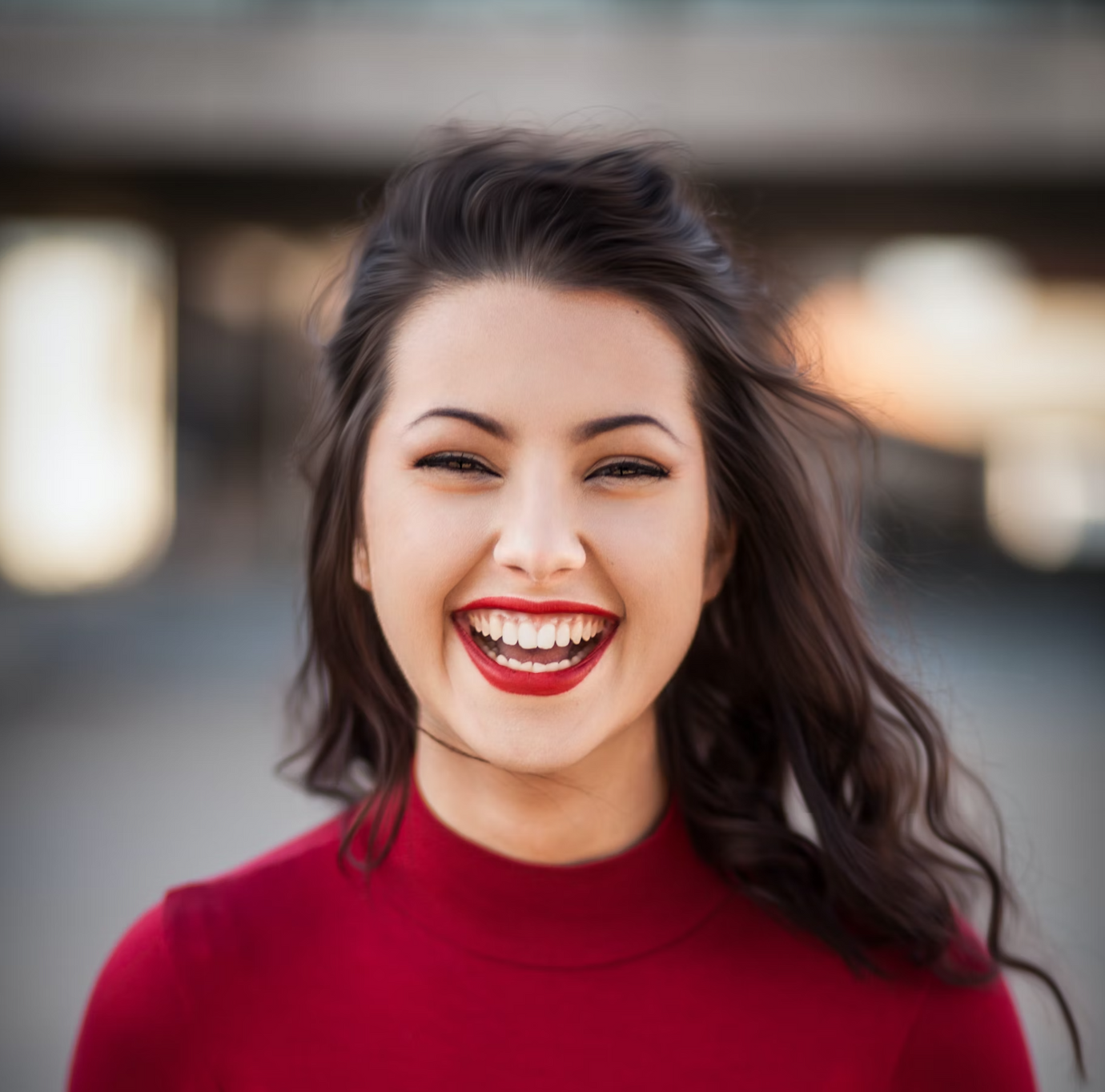 Portrait of a smiling woman with a red shirt